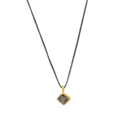 Gold pendant with rough diamond and silver chain